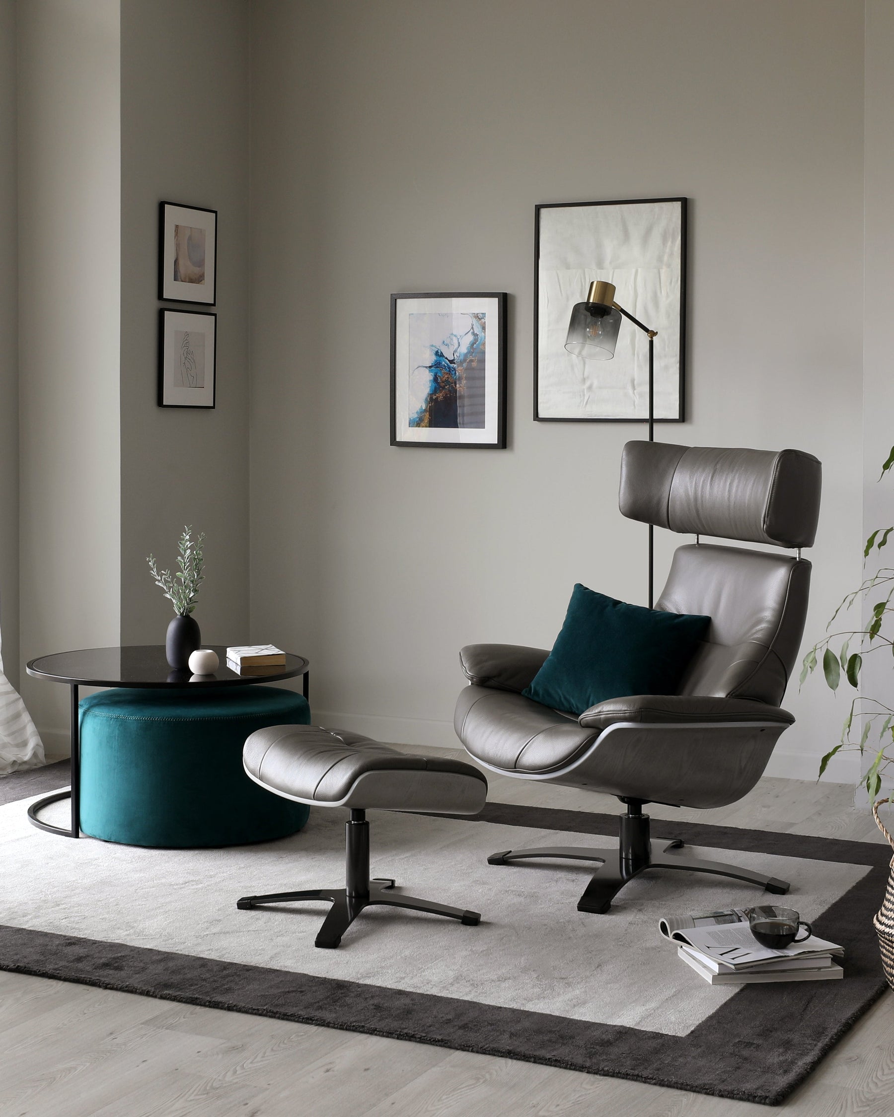 Karma dark grey leather swivel recliner accent chair and footstool