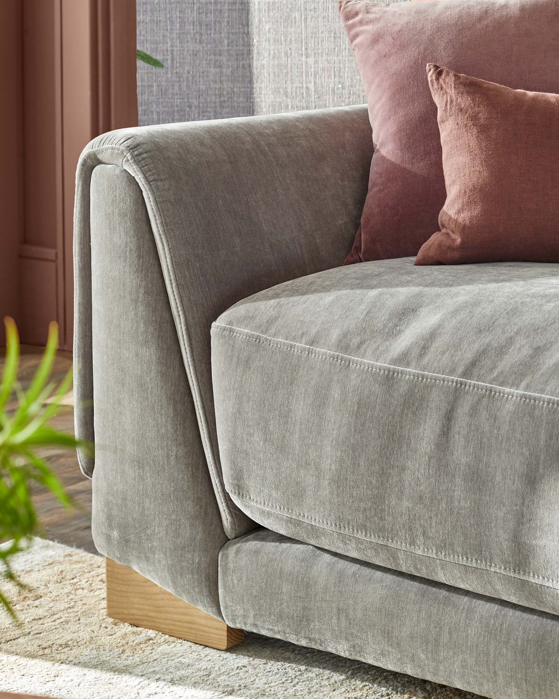 Saige mid grey fabric armchair with natural wood legs