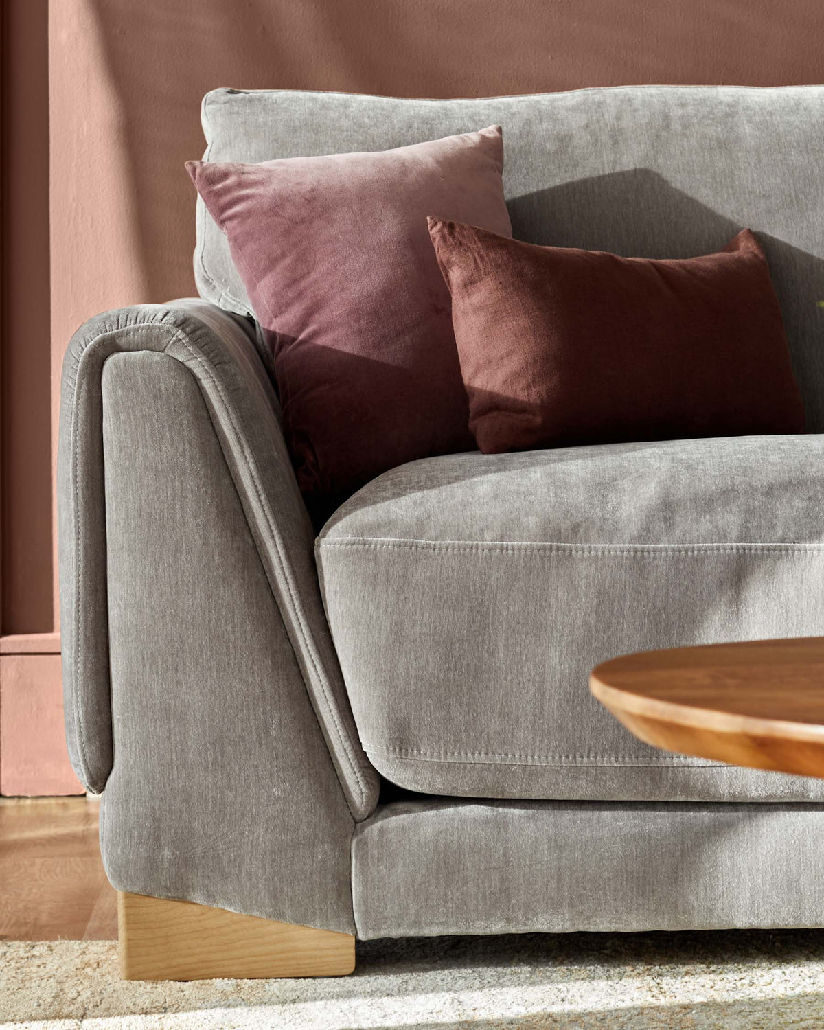 Saige mid grey fabric armchair with natural wood legs