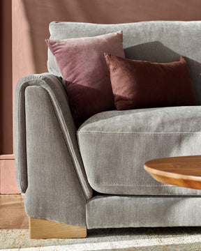 Saige mid grey fabric armchair with natural wood legs